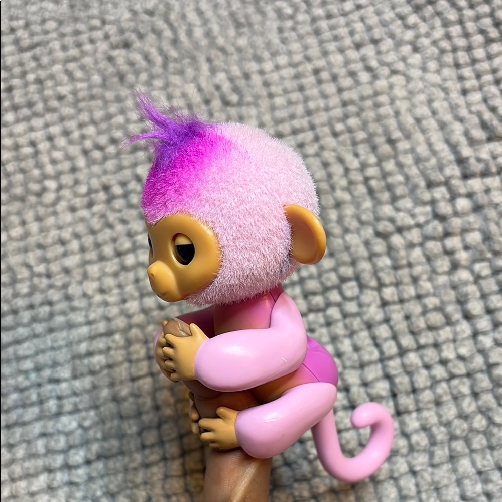 Pink and Purple Animal Figurine with Expressive Eyes